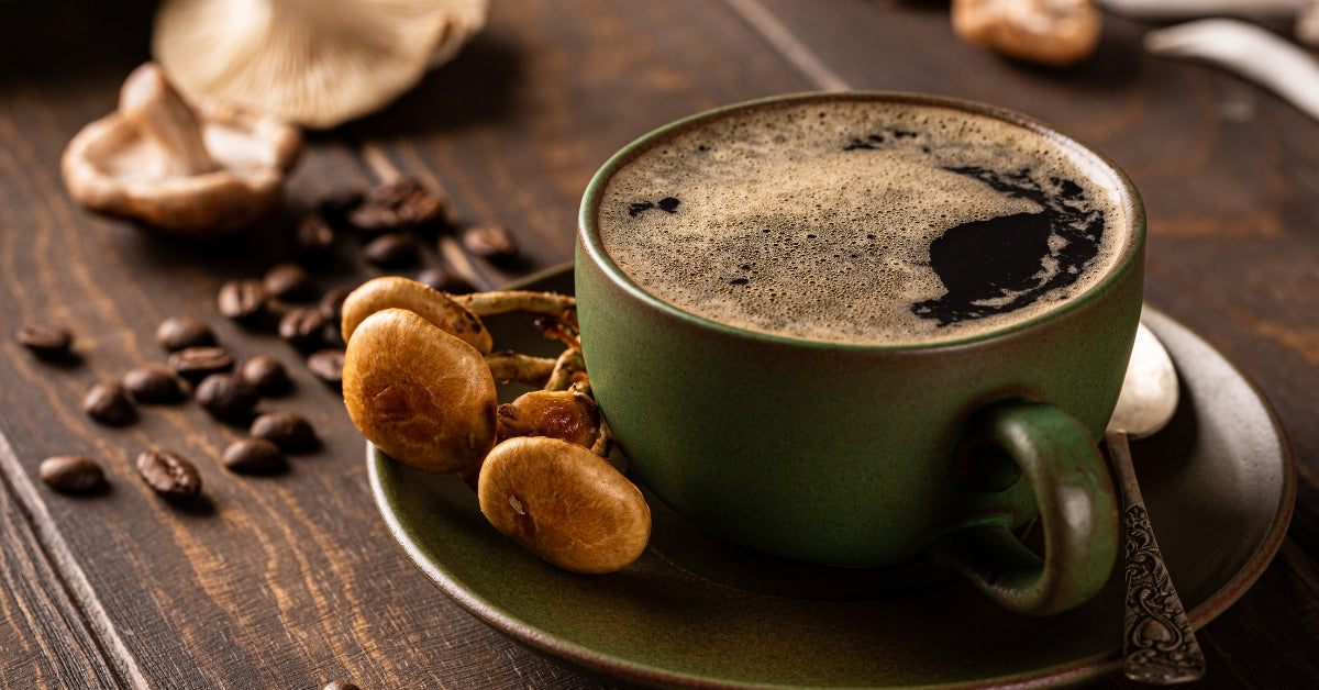 A cup of coffee and mushrooms on top of a rustic table